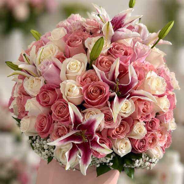 Pink and white rose bouquet with lilies in a blush hat box