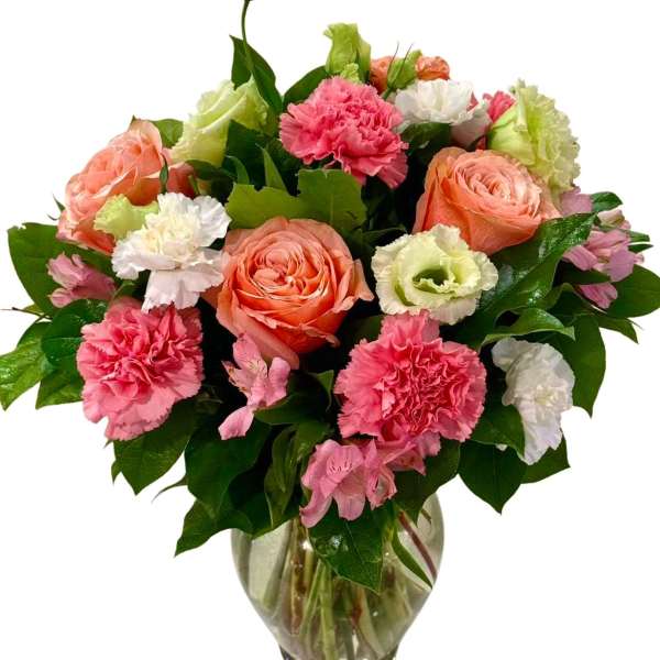 Pink and peach bouquet in a glass vase
