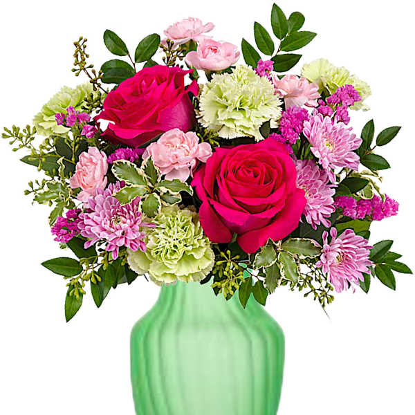 Pink roses and mixed flowers in a green vase