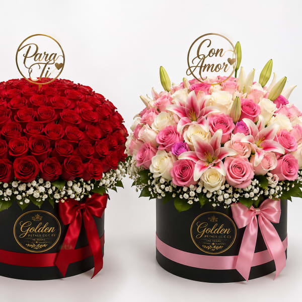 Two round flower boxes with red roses and pink mixed blooms