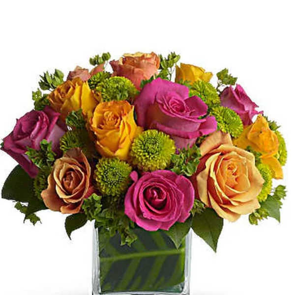 Colorful roses arranged in a clear square vase