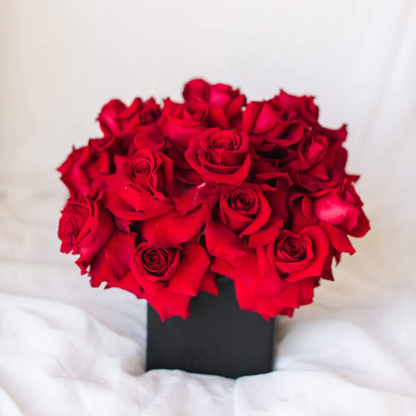 Red rose bouquet in a black box