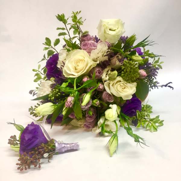 Bouquet of white and purple flowers with a matching boutonniere