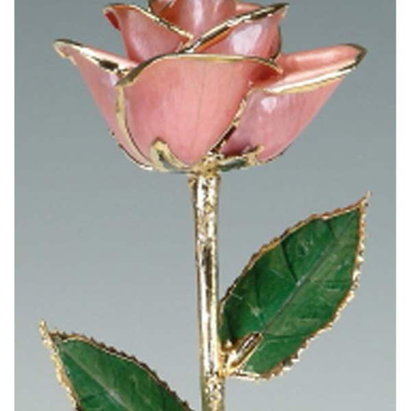 Pink rose-shaped ornament with green leaves and gold trim