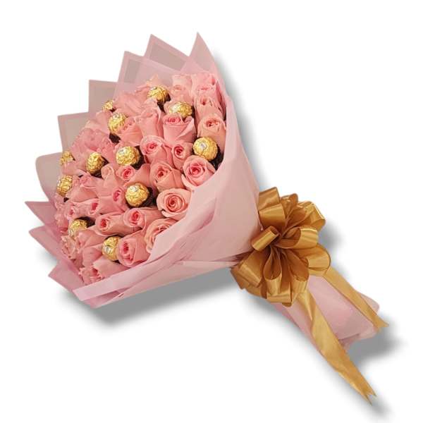 Pink rose bouquet with gold-wrapped chocolates and a gold ribbon