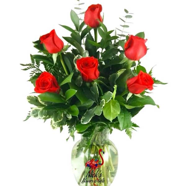 Bouquet of red roses in a clear glass vase