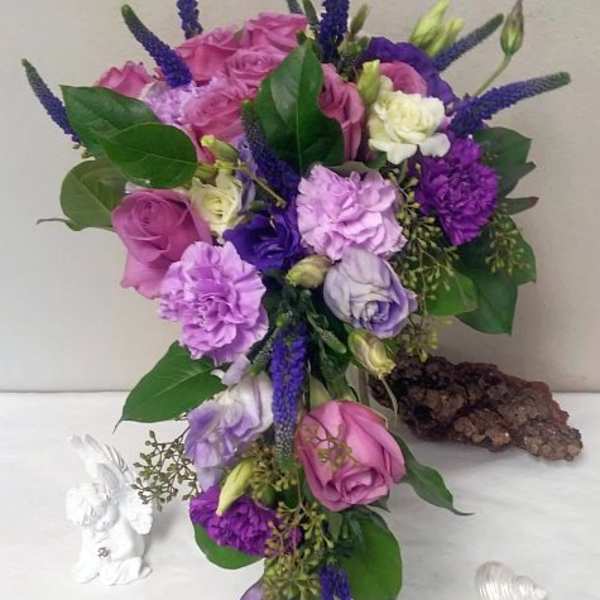 Purple and pink bouquet with roses and carnations