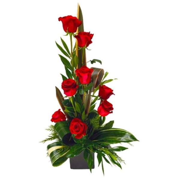 Tall arrangement of red roses in a dark vase