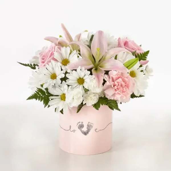 Pink and white bouquet in a pale pink box with a heart design