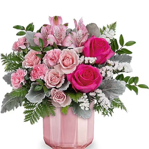 Pink roses and alstroemeria in a pink glass vase
