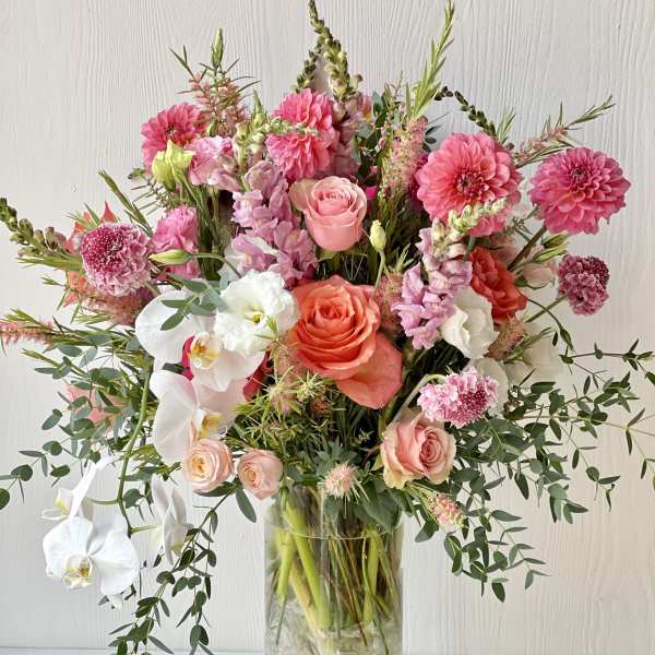 Pink and white mixed bouquet in a clear glass vase
