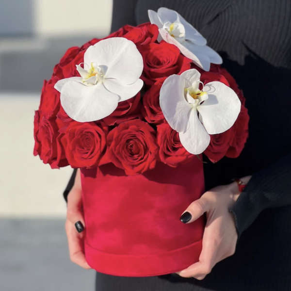 Red rose bouquet with white orchids in a red hat box