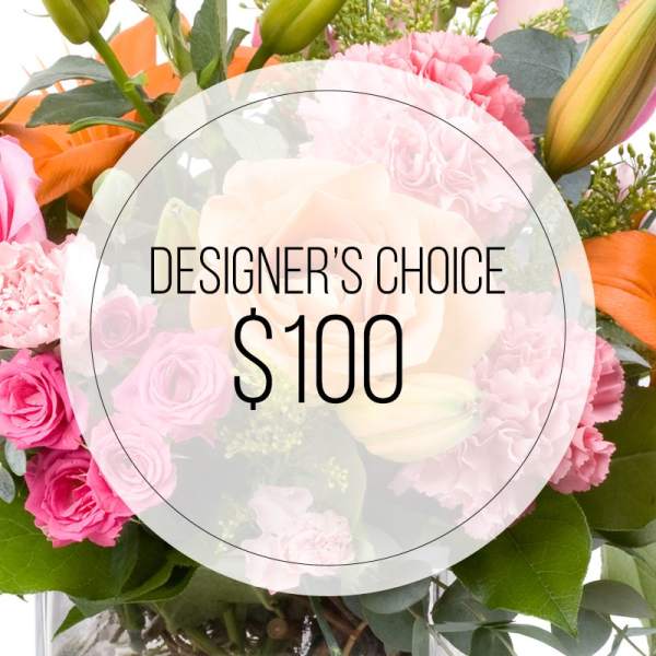 Mixed pink and orange flower bouquet with a $100 designer's choice label