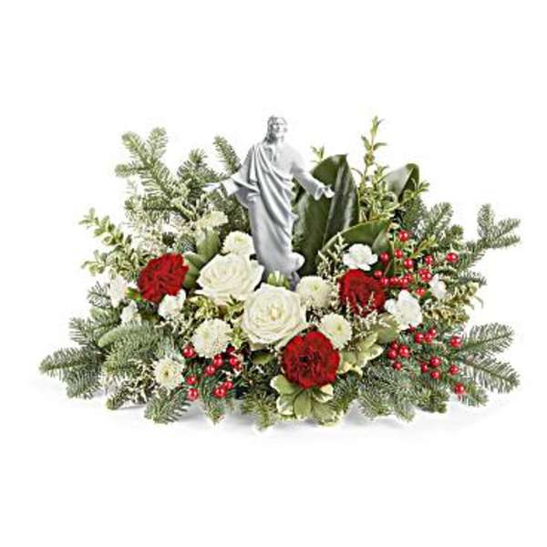 White and red floral arrangement with a small statue centerpiece