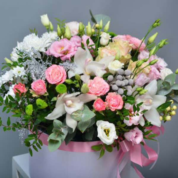 Pink and white mixed bouquet in a round box with a pink ribbon