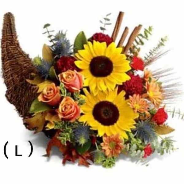 Autumn bouquet with sunflowers, roses, and a woven horn-shaped basket