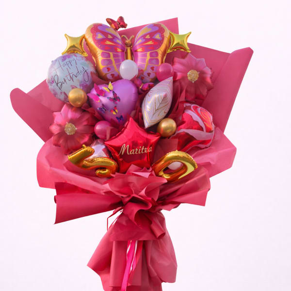 Pink balloon bouquet with butterfly and birthday balloons