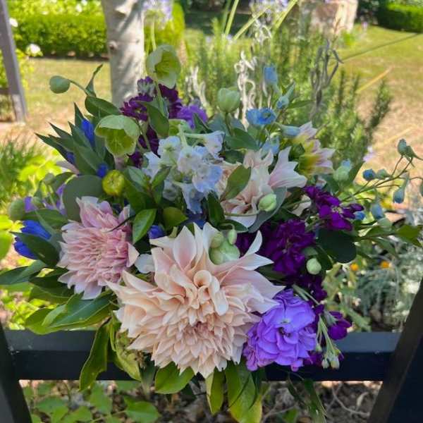Mixed bouquet with pale pink, purple, blue, and white flowers