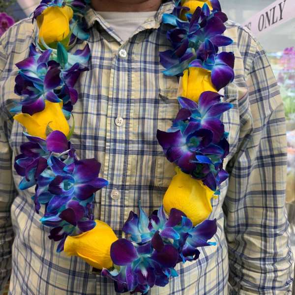 Blue orchid with yellow roses