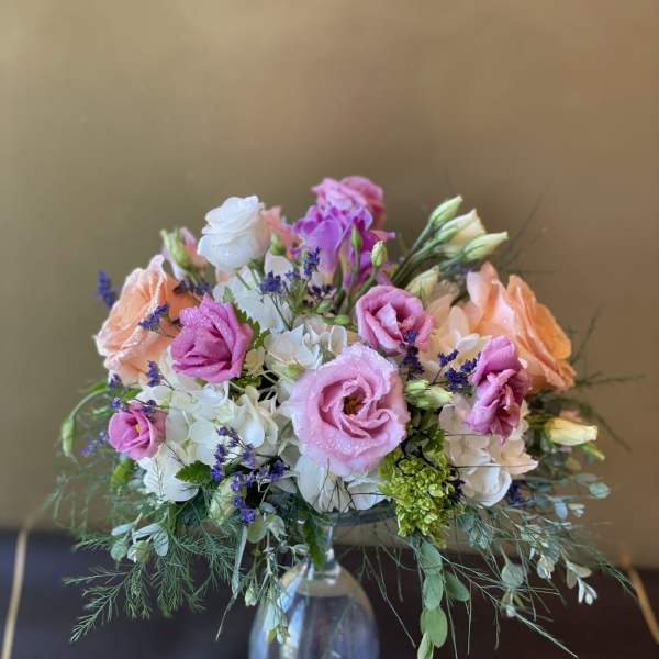 Pink and peach bouquet in a clear glass vase