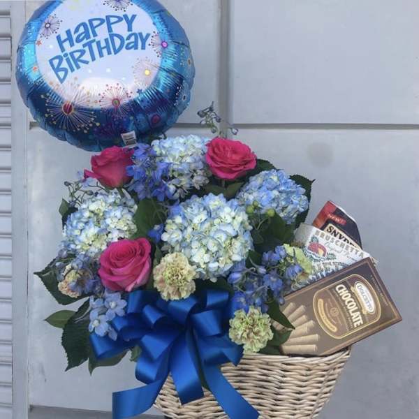 Birthday balloon with a flower basket and chocolates