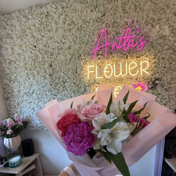 Pink and white bouquet with roses, carnations, and alstroemeria