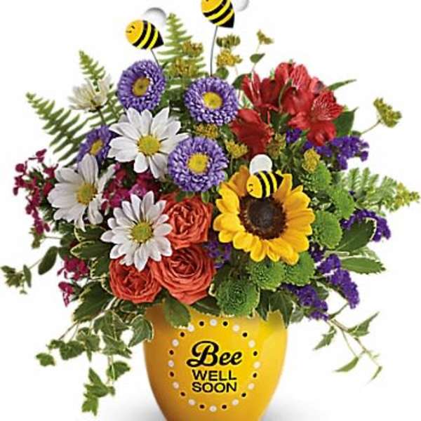 Colorful bouquet in a yellow vase with bee decorations and "Bee Well Soon" text