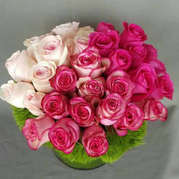 Bouquet of pink and pale blush roses in a round arrangement