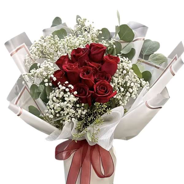 Bouquet of red roses with white baby's breath and eucalyptus in white wrap