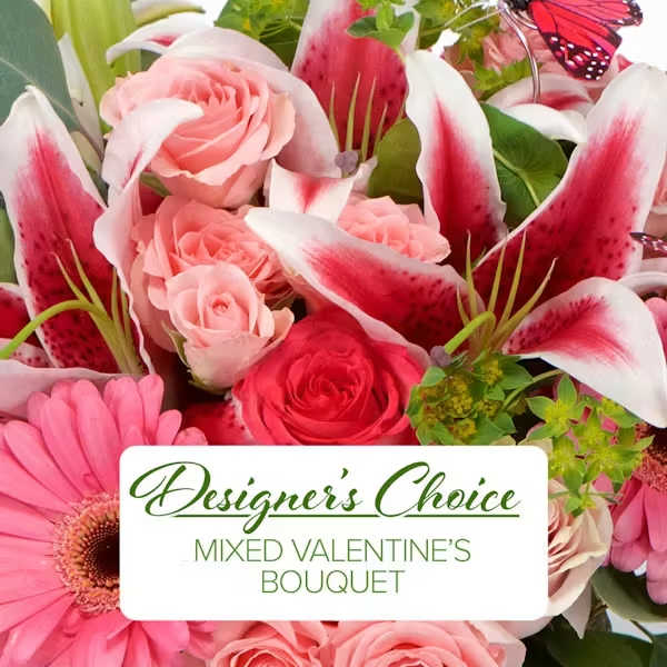 Mixed bouquet of pink roses, lilies, and a pink gerbera daisy with butterfly accents