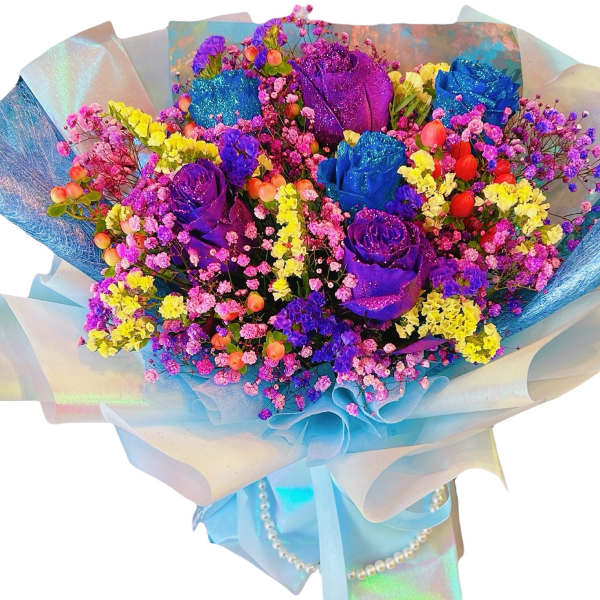 Bouquet of multicolored roses and small filler flowers wrapped in blue paper