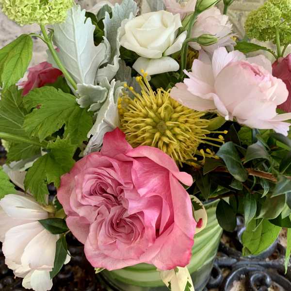 Pink and white mixed bouquet with roses and chrysanthemums in a vase