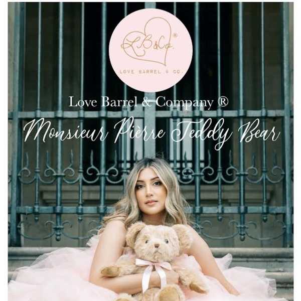 Woman in a pink dress holding a teddy bear with brand text overlaid