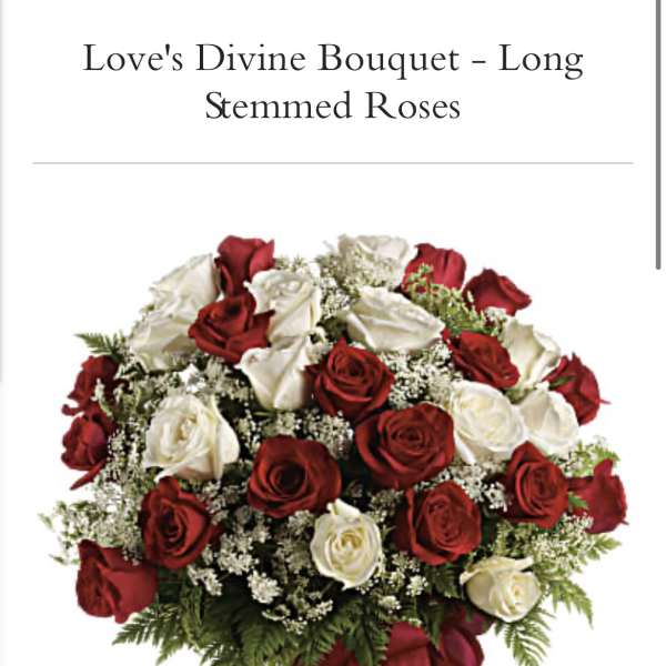 Bouquet of red and white roses in a clear glass vase
