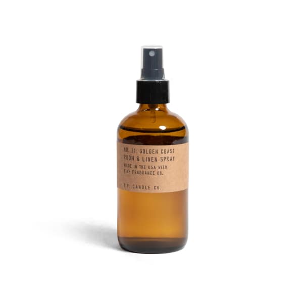 Amber room spray bottle with black pump and kraft label
