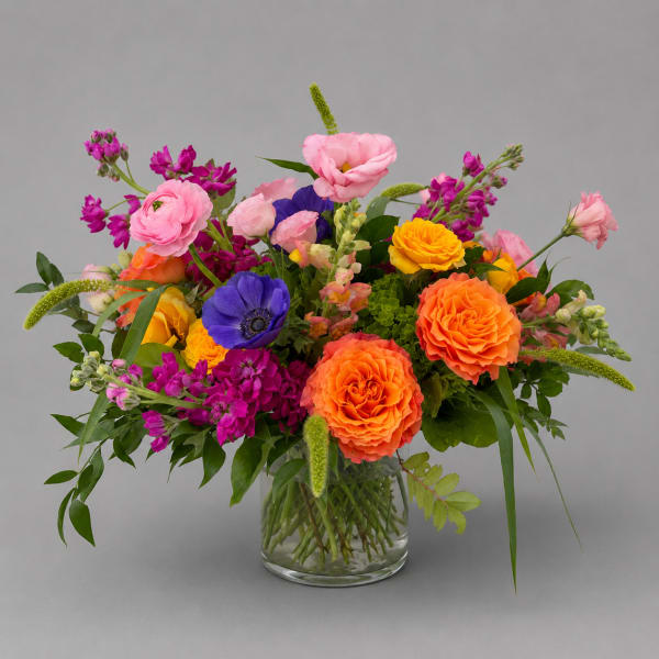Colorful mixed bouquet in a clear glass vase