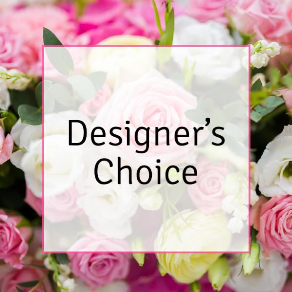 Pink and white roses with small white blossoms behind a "Designer’s Choice" label