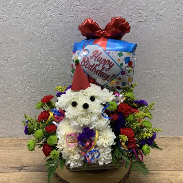 Birthday flower arrangement with a balloon topper and colorful blooms