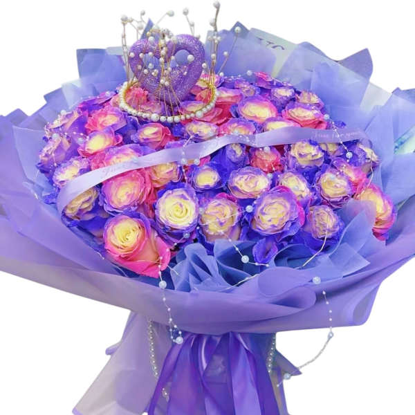 Purple and pink rose bouquet with ribbon and pearl accents
