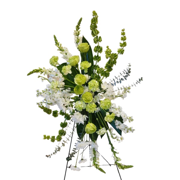 Tall green and white floral standing spray on an easel