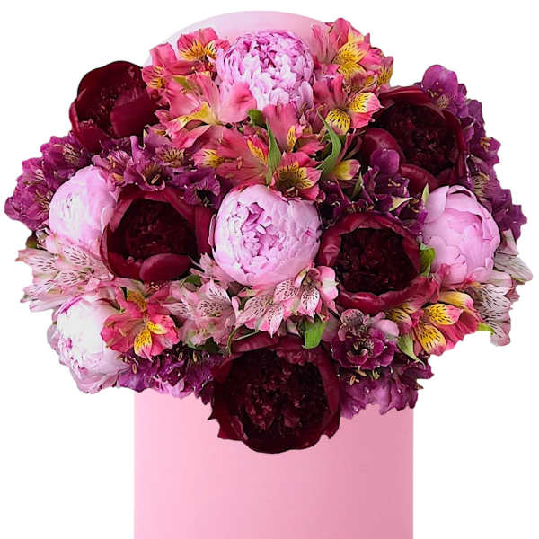 Pink and burgundy flower arrangement in a round pink box