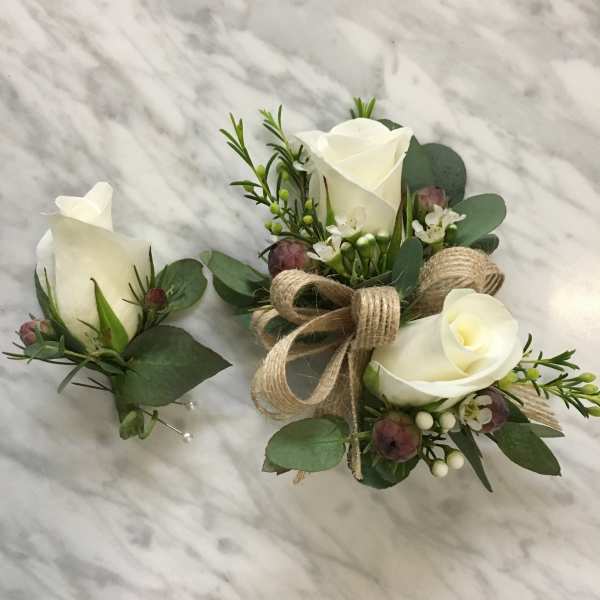 White rose boutonniere and matching wrist corsage with greenery and burlap ribbon