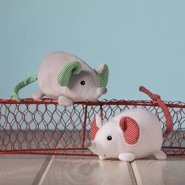 Two plush mice toys on a red wire basket