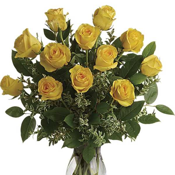 Yellow roses arranged in a clear glass vase