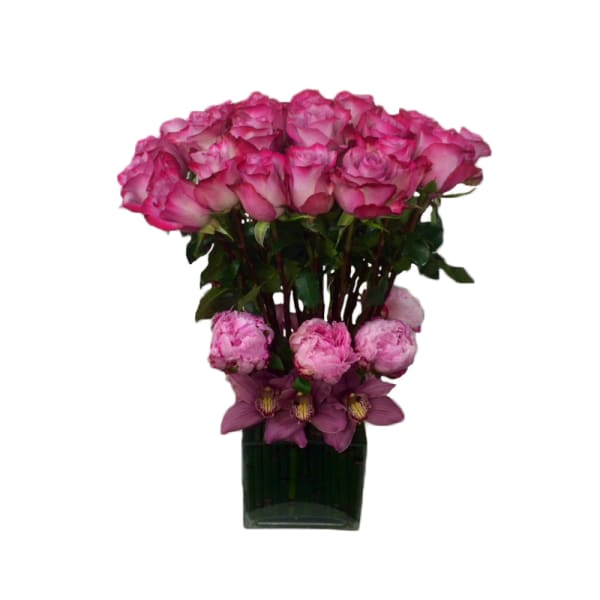 Pink roses and purple flowers arranged in a dark glass vase