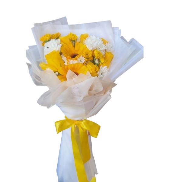 Yellow and white mixed bouquet wrapped in pale paper with a yellow ribbon