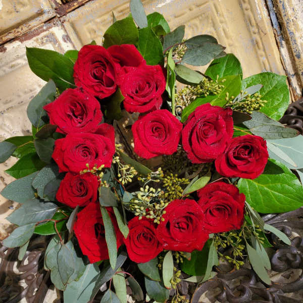 Bouquet of red roses with eucalyptus and greenery