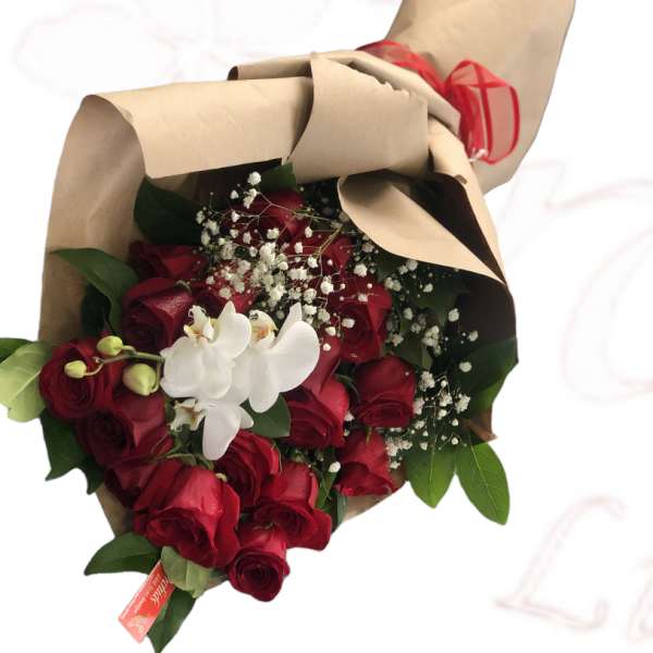 Bouquet of red roses with white orchids wrapped in brown paper