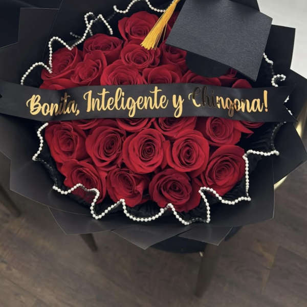 Bouquet of red roses with a graduation cap and gold tassel
