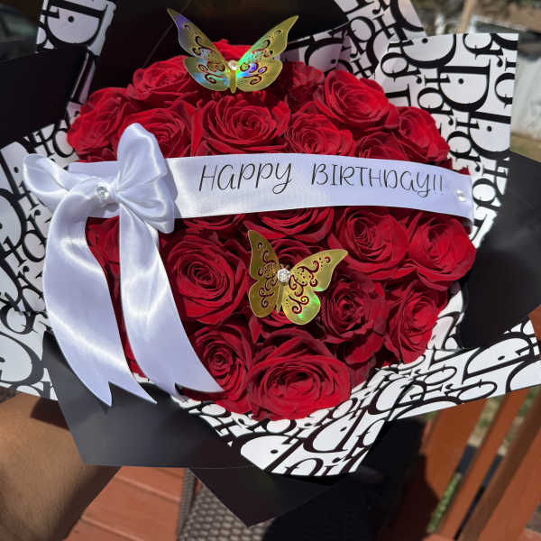 Red rose bouquet with a Happy Birthday ribbon and white bow